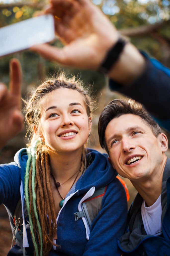 Girl taking a selfie with her father. Therapy for teens in Blaine MN