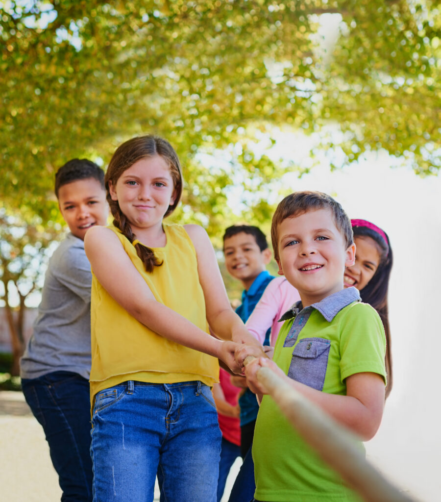 Group of kids pulling on a rope. Therapy for children in Blaine Mn