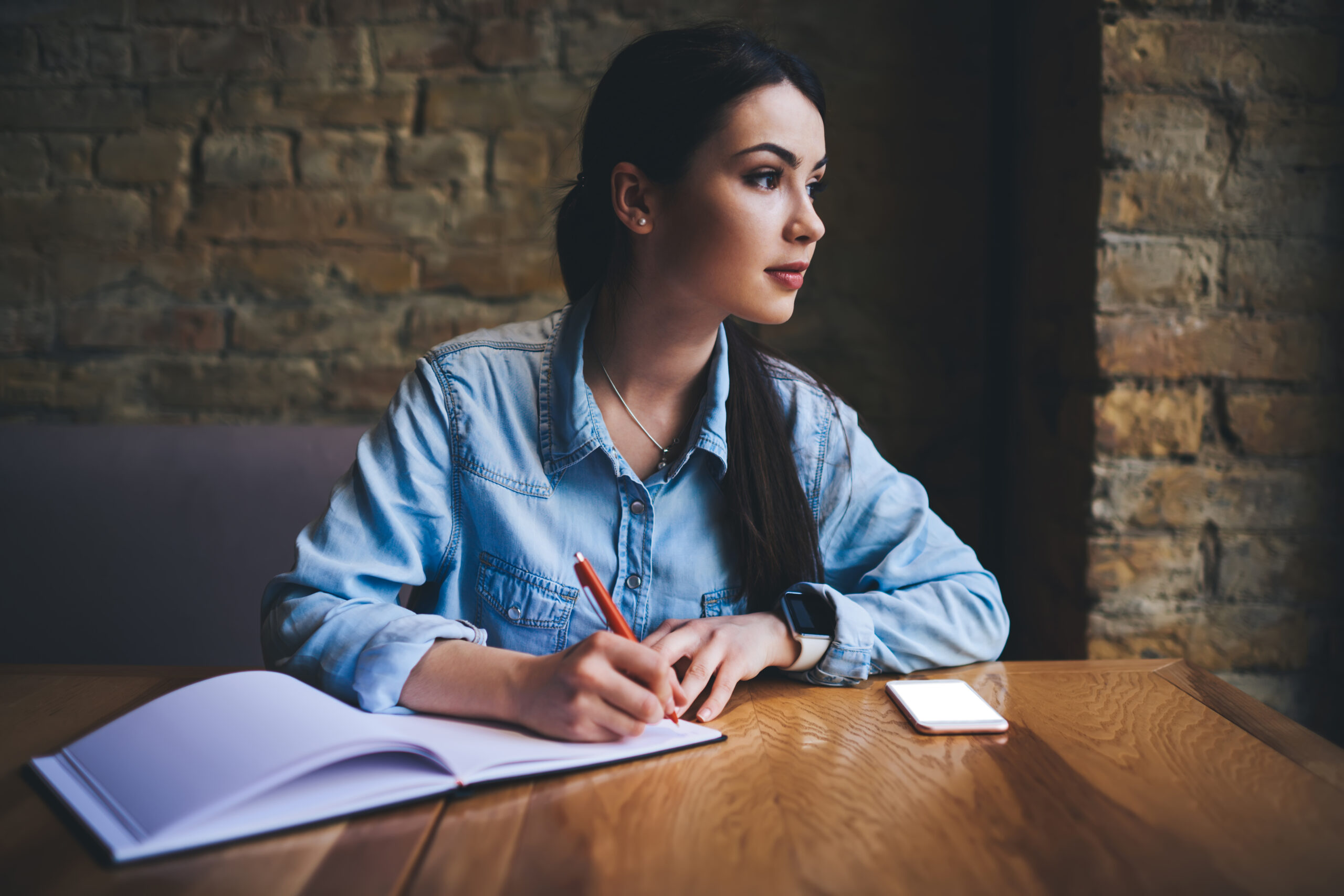 Therapy for intrusive thoughts in Blaine MN. Girl writing in a notebook.