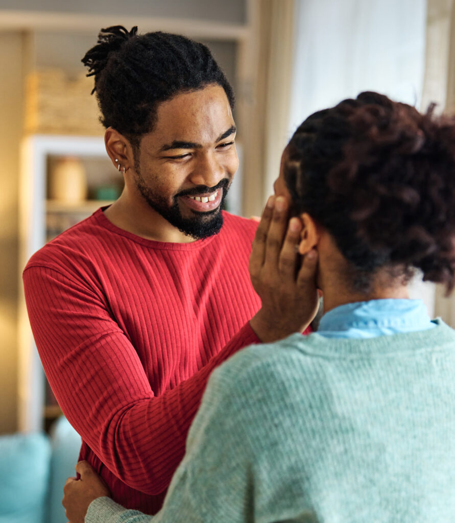 Black couple in a soft embrace. Therapy for couples in Blaine MN