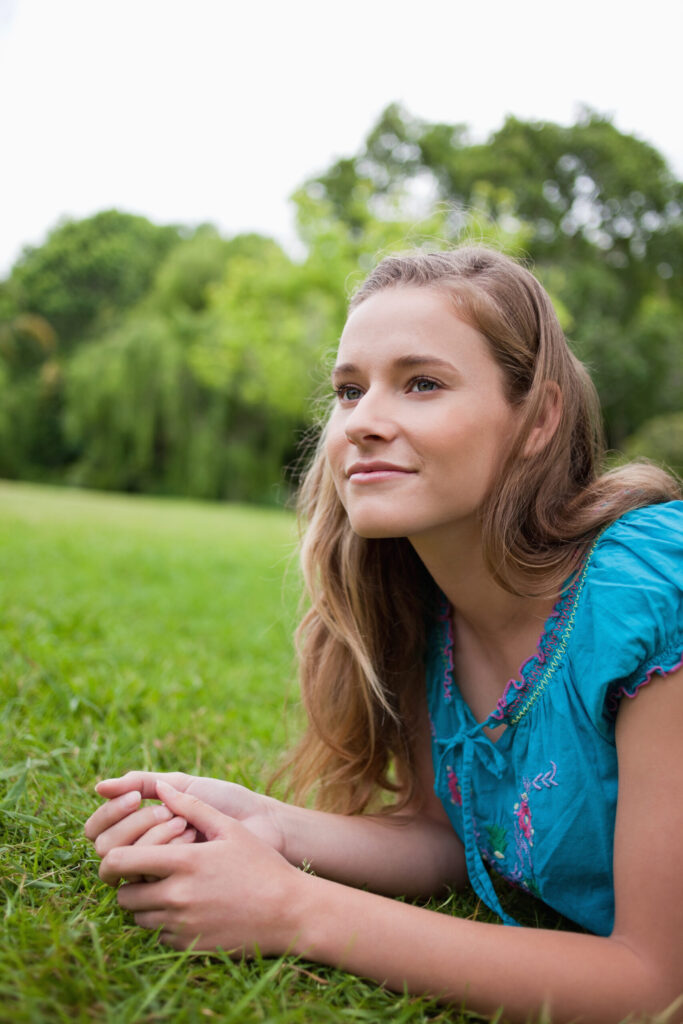 Therapy for self esteem in blaine mn. Teenage girl sitting in the grass