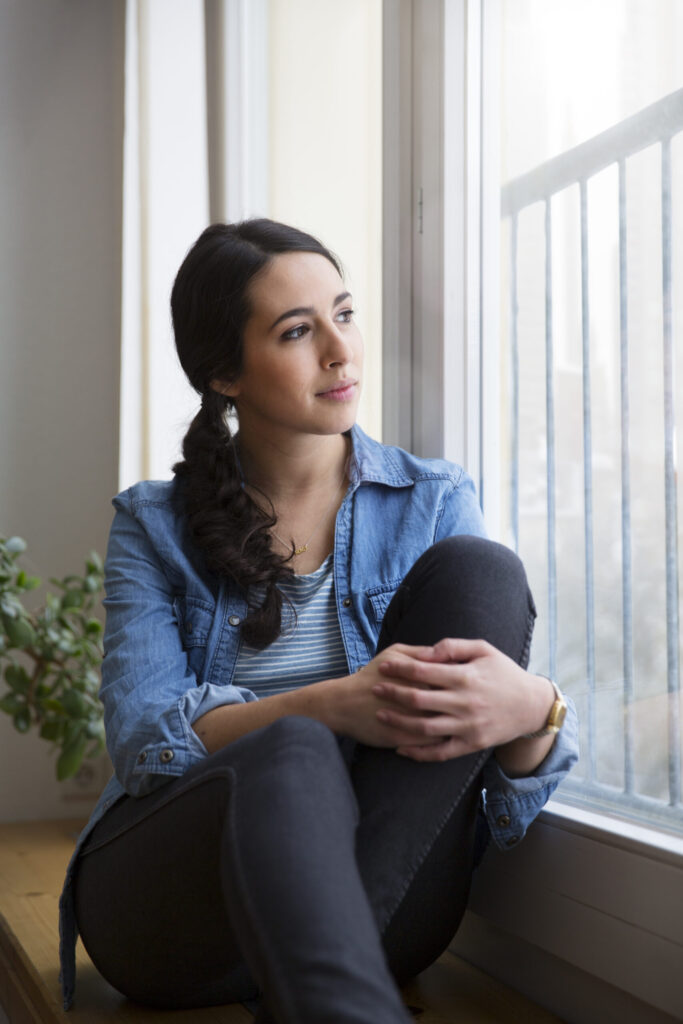 Therapy for anxiety in blaine mn . Woman staring out the window.