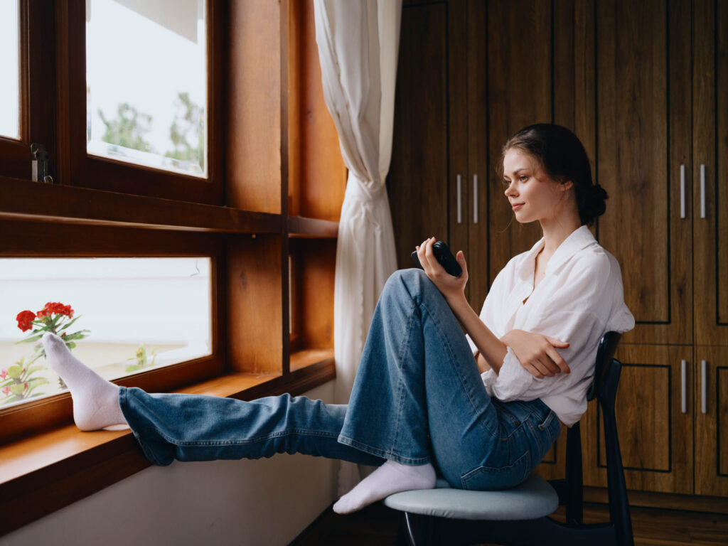 Therapy in Blaine MN Woman sitting by the window.