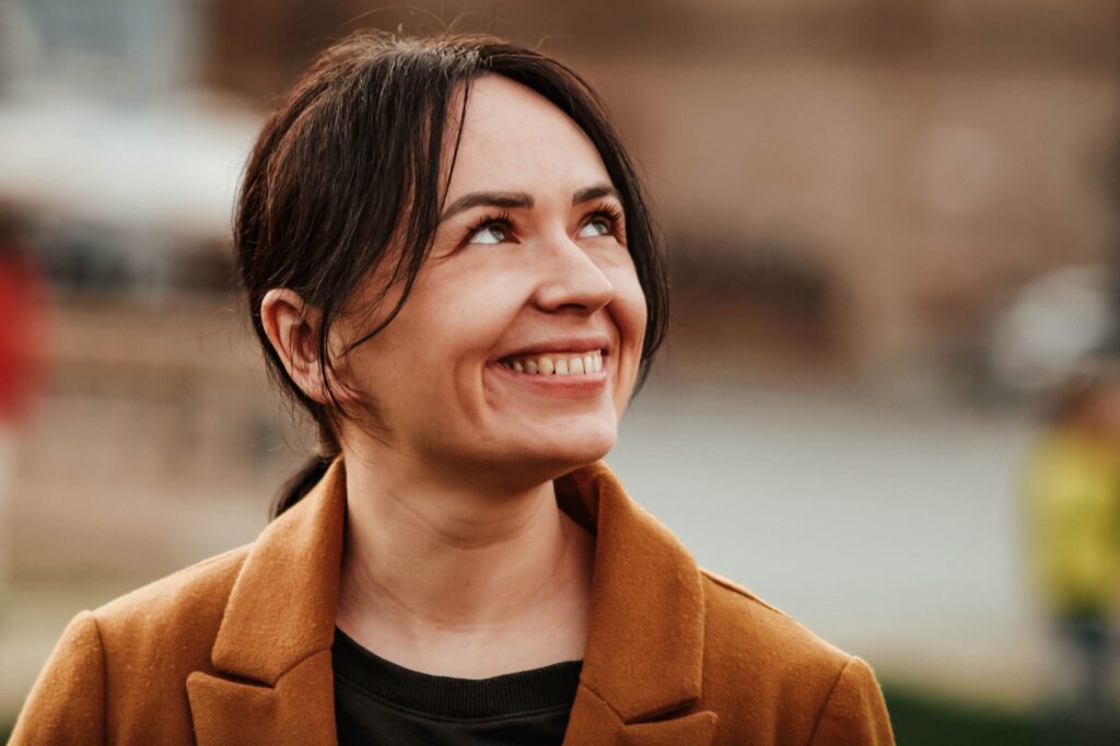 Therapy for self esteem in blaine mn. Woman looking up athe sky with a smile.