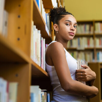 Black african american young girl student studying at the school university library