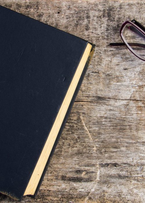 book-and-glasses-on-rustic-wooden-background-2026-03-26-08-01-56-utc