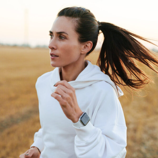 Navigating Divorce in Blaine MN Woman jogging in the field.