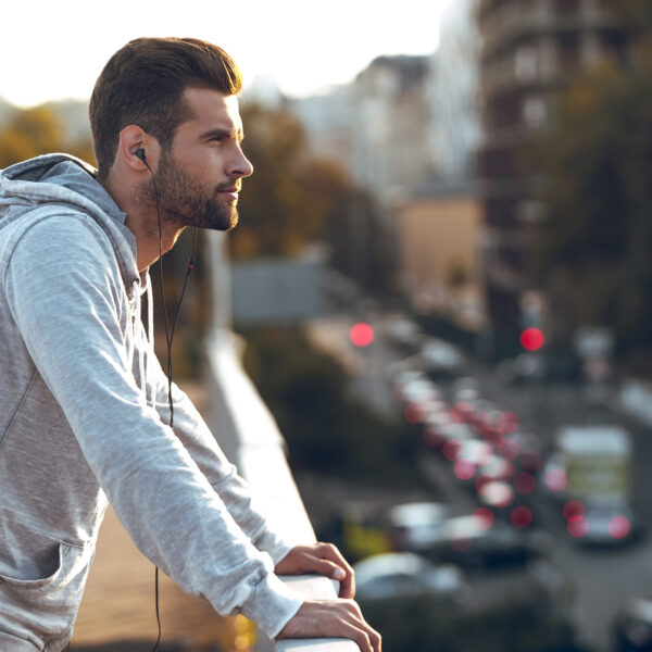 Man standing on a balcony. Therapy for major life changes in blaine mn.