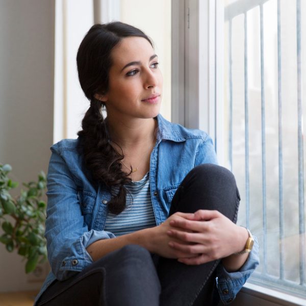 Therapy for anxiety in blaine mn . Woman staring out the window.