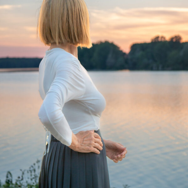 Woman standing in front of a lake. Support for menopause depression and anxiety in blaine MN